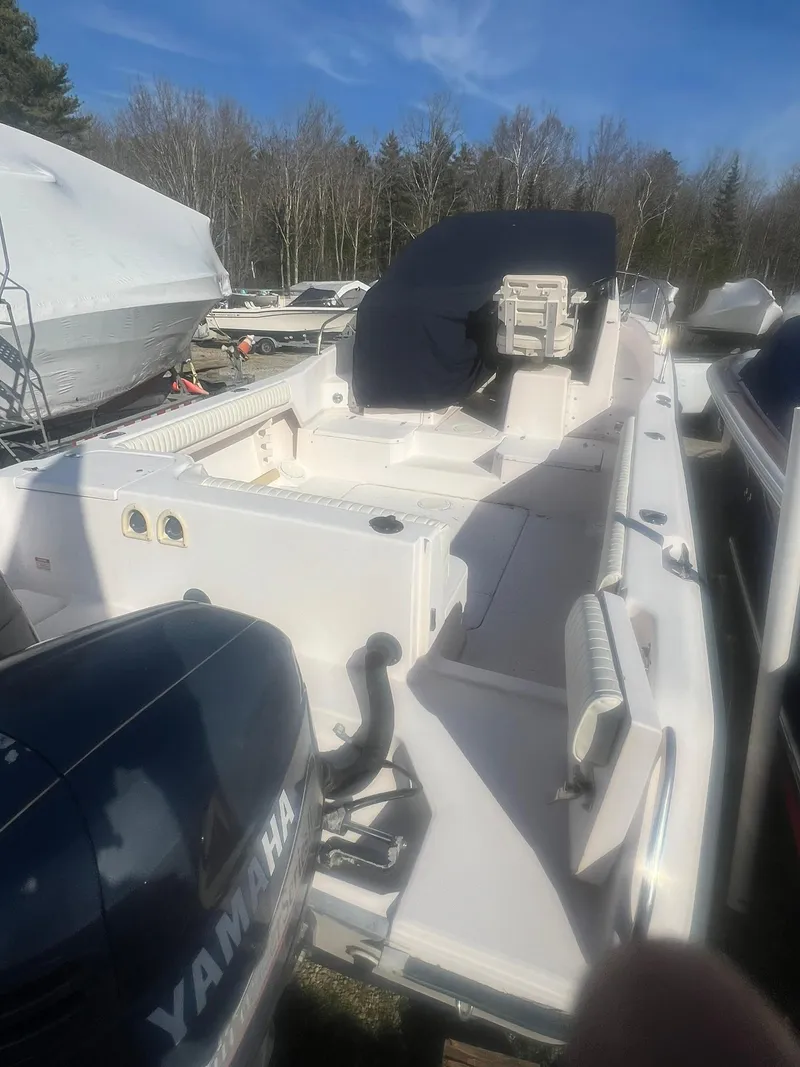 Slide: The Image of 1998 Grady-White Voyager 268 boat with Yamaha engine, docked outdoors. - 9