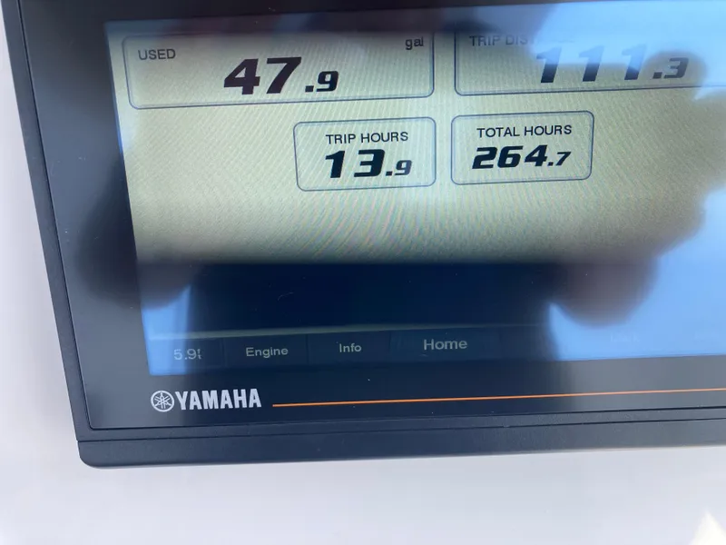Slide: The Image of Yamaha display showing fuel usage and engine hours on Everglades 235 Center Console, 2020 model. - 21