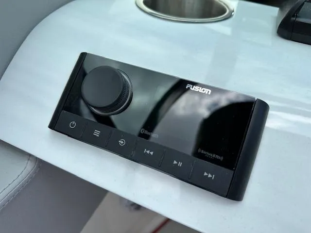 Slide: The Image of Fusion audio control panel on 2025 Regal LS4 boat dashboard. - 11