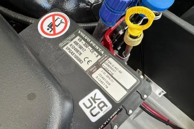 Slide: The Image of Close-up of a Volvo Penta engine component in a 2025 Regal LS4 boat. - 27