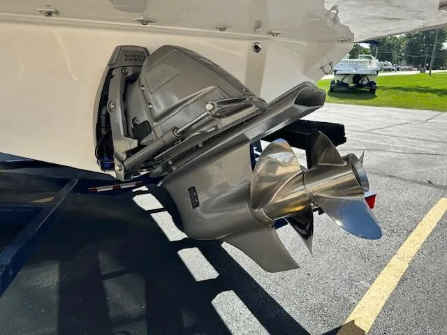 Slide: The Image of 2025 Regal LS4 boat propeller and outdrive in a sunny outdoor setting. - 28