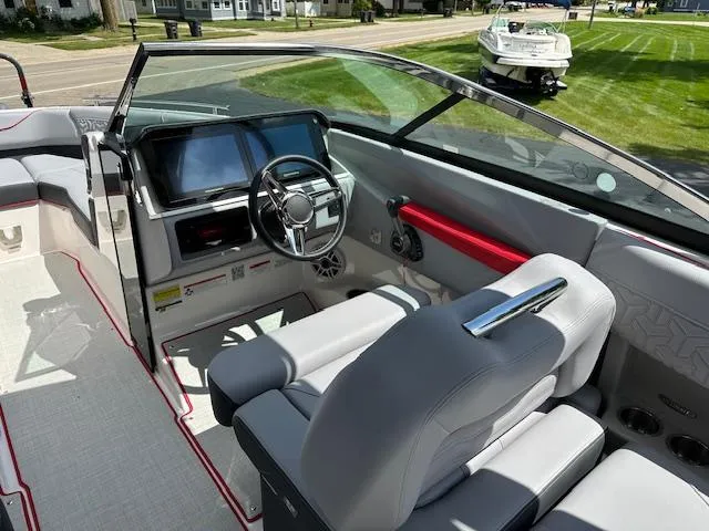 Slide: The Image of 2025 Regal LS4 boat interior with modern dashboard and steering wheel. - 4