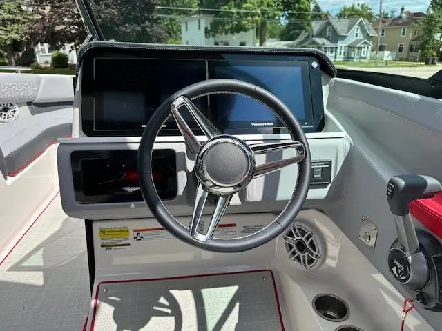 Slide: The Image of 2025 Regal LS4 boat dashboard with modern steering wheel and digital displays. - 5