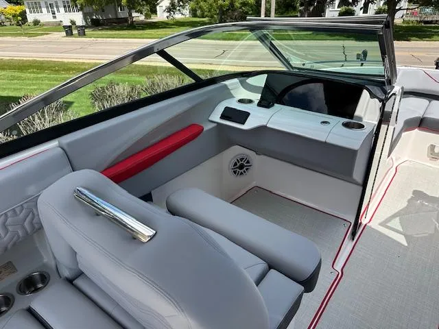 Slide: The Image of 2025 Regal LS4 boat interior with modern dashboard and seating. - 8