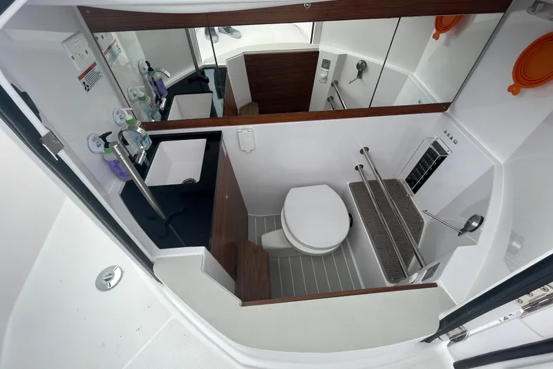 Slide: The Image of Modern bathroom in 2022 Axopar 28 CABIN boat with toilet and sink. - 13