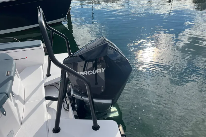 Slide: The Image of Axopar 28 CABIN 2022 with Mercury outboard motor on calm water. - 22