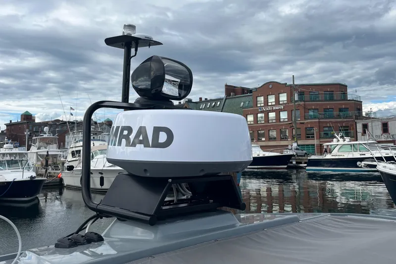 Slide: The Image of Axopar 28 CABIN 2022 with radar system, docked in a marina. - 36