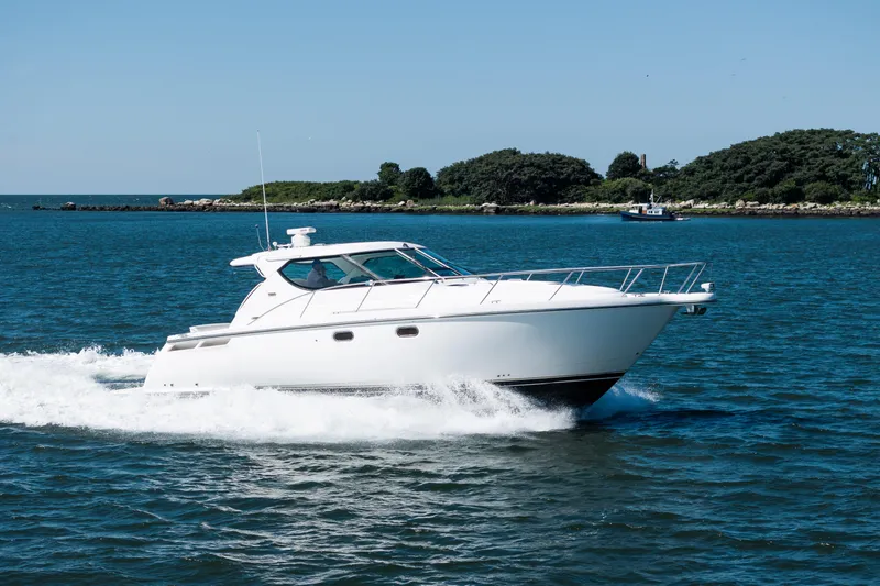 Slide: The Image of 2007 Tiara Yachts 4300 Sovran cruising on open water. - 1