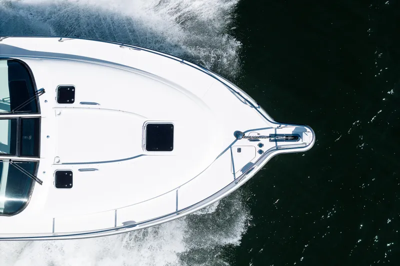 Slide: The Image of Aerial view of 2007 Tiara Yachts 4300 Sovran cruising on water. - 10