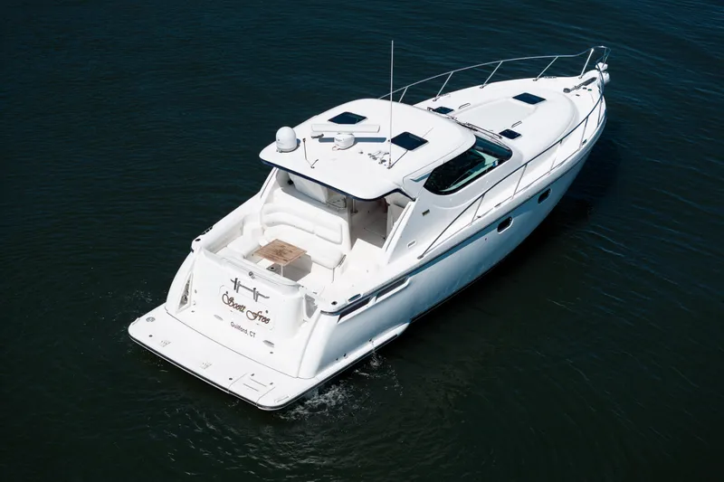 Slide: The Image of 2007 Tiara Yachts 4300 Sovran cruising on calm waters. - 13