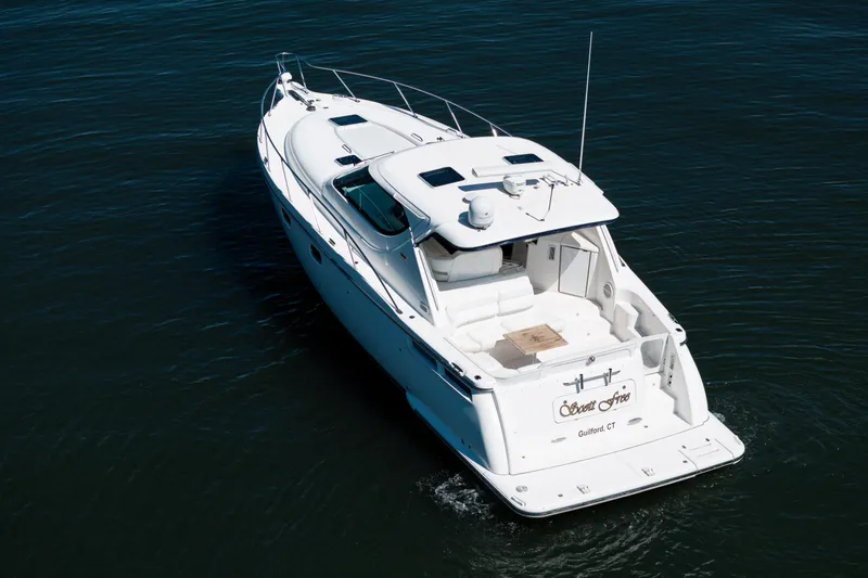 Slide: The Image of 2007 Tiara Yachts 4300 Sovran cruising on open water. - 14