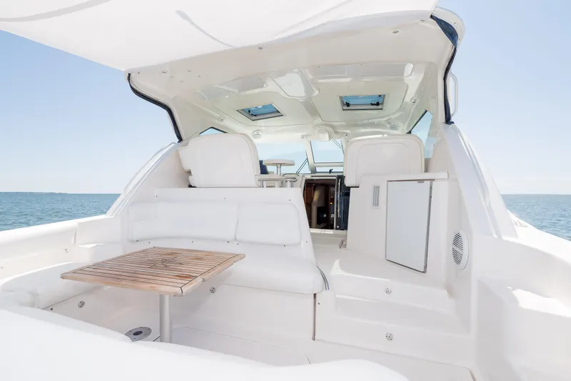 Slide: The Image of 2007 Tiara Yachts 4300 Sovran interior with white seating and ocean view. - 21