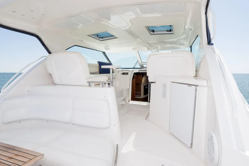 Slide: The Image of 2007 Tiara Yachts 4300 Sovran interior with white seating and ocean view. - 22