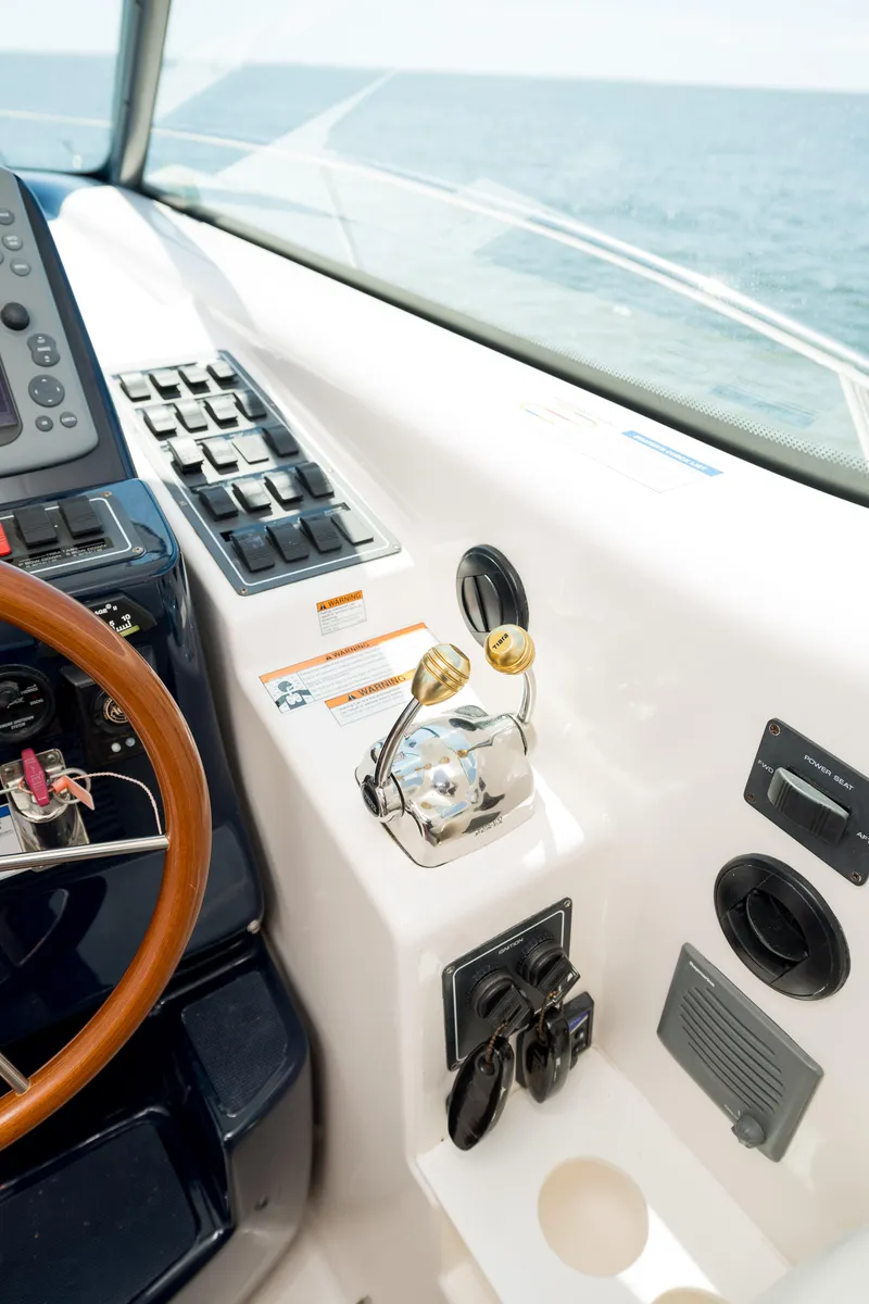 Slide: The Image of 2007 Tiara Yachts 4300 Sovran helm controls with ocean view. - 28