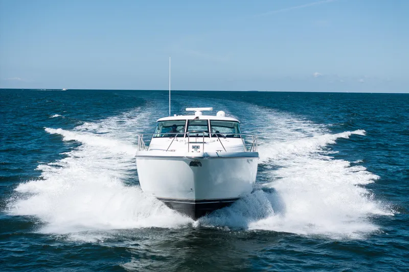 Slide: The Image of 2007 Tiara Yachts 4300 Sovran cruising on open water. - 3