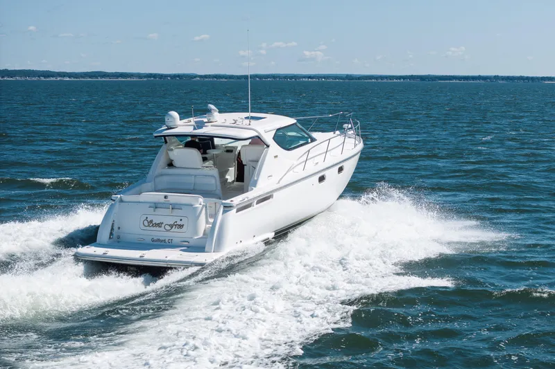 Slide: The Image of 2007 Tiara Yachts 4300 Sovran cruising on open water. - 6