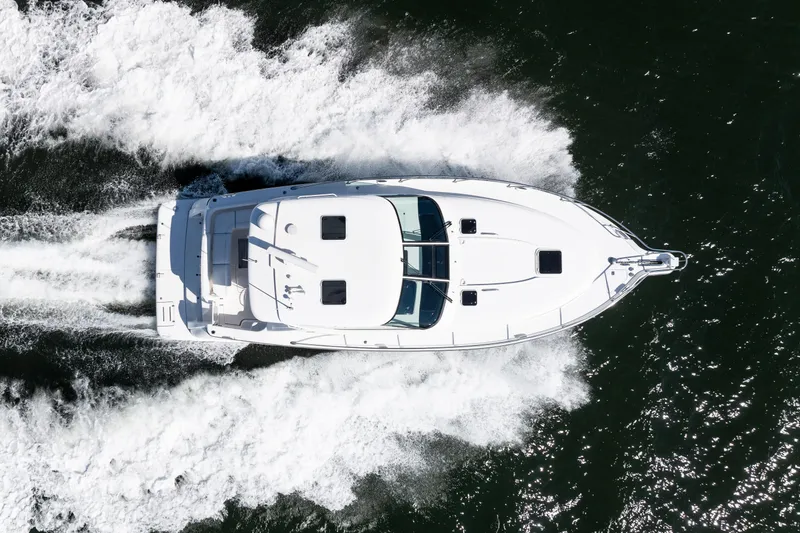 Slide: The Image of Aerial view of 2007 Tiara Yachts 4300 Sovran cruising on water. - 9