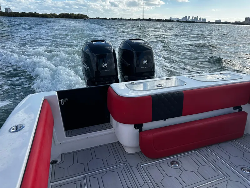 Slide: The Image of 2004 Contender 31 Tournament boat with dual engines on open water. - 12