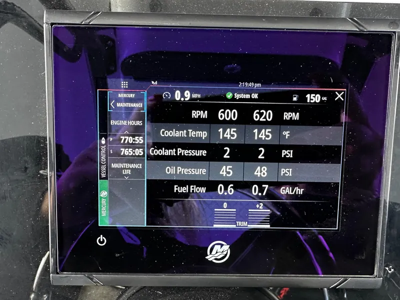 Slide: The Image of Boat engine display showing RPM, coolant temperature, pressure, and fuel flow for 2004 Contender 31 Tournament. - 23