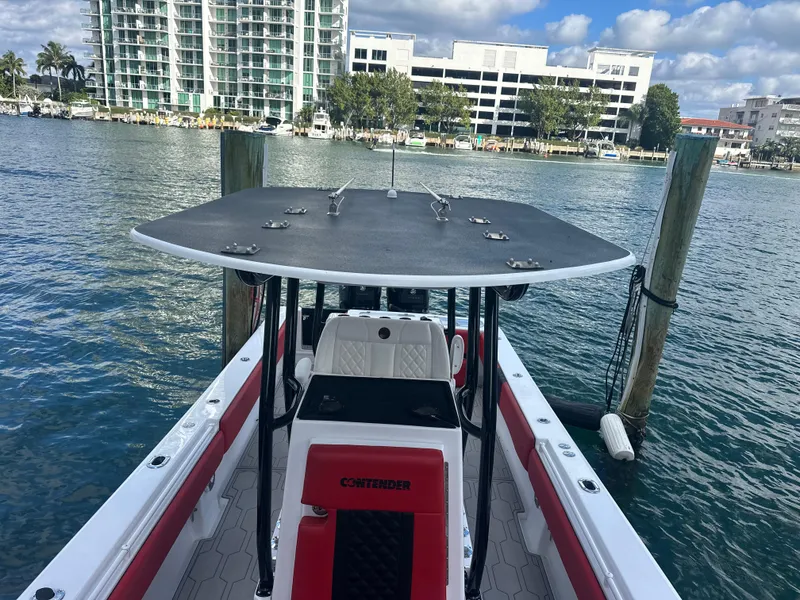 Slide: The Image of 2004 Contender 31 Tournament boat docked by waterfront buildings. - 29