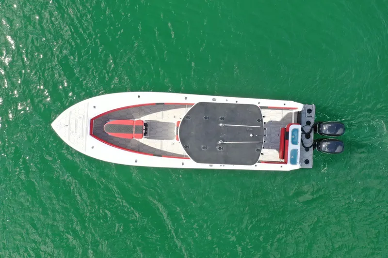 Slide: The Image of Aerial view of 2004 Contender 31 Tournament boat on green water. - 4