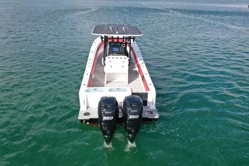 Slide: The Image of 2004 Contender 31 Tournament boat with dual 350 engines on open water. - 5