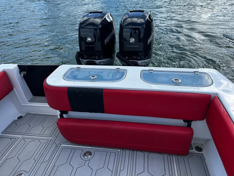 Slide: The Image of 2004 Contender 31 Tournament boat with dual Mercury engines and red seating. - 9