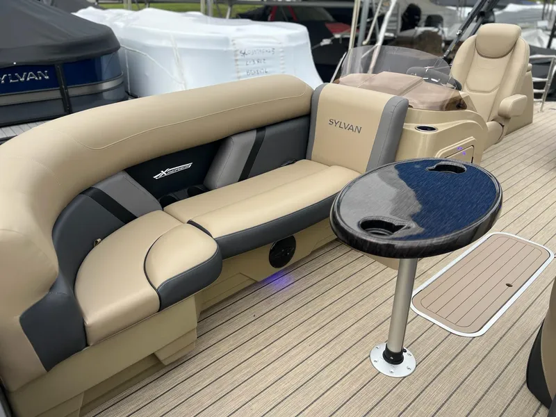 Slide: The Image of Luxurious seating on 2025 Sylvan X3 CLZ DH Mirage Tritoon boat interior. - 11
