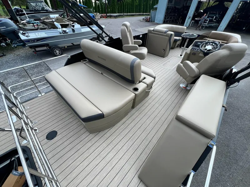 Slide: The Image of 2025 Sylvan X3 CLZ DH Mirage Tritoon interior with luxurious seating and modern design. - 13