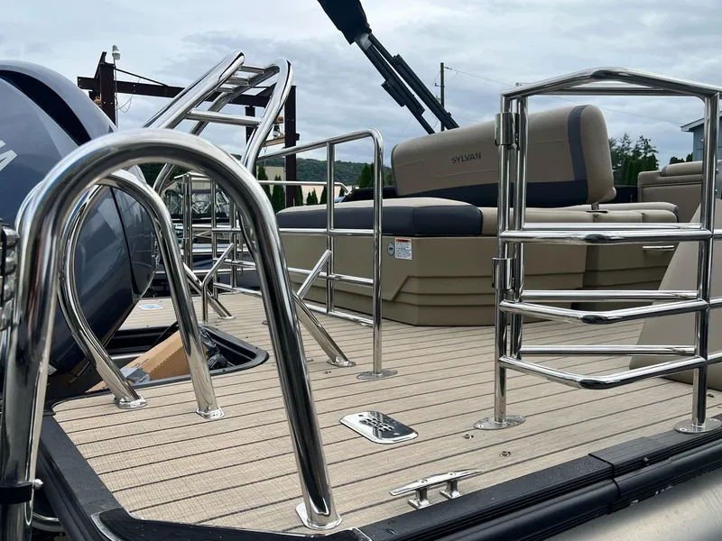 Slide: The Image of 2025 Sylvan X3 CLZ DH Mirage Tritoon with sleek metal railings and comfortable seating. - 15