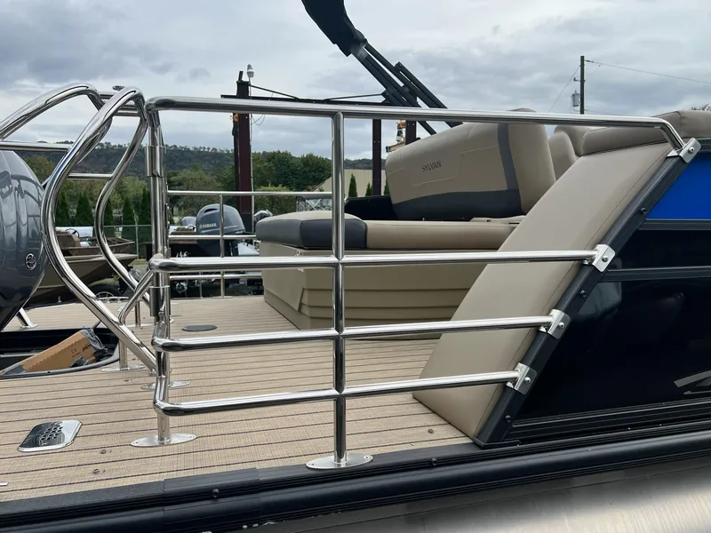 Slide: The Image of 2025 Sylvan X3 CLZ DH Mirage Tritoon with sleek railing and comfortable seating. - 21