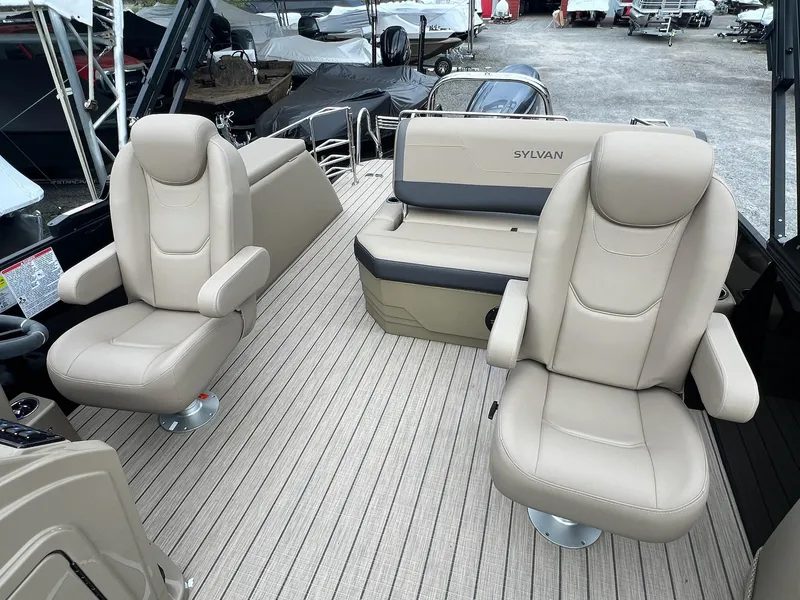 Slide: The Image of 2025 Sylvan X3 CLZ DH Mirage Tritoon interior with beige seating and modern design. - 34