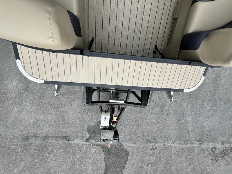 Slide: The Image of 2025 Sylvan X3 CLZ DH Mirage Tritoon boat trailer hitch and deck view. - 35