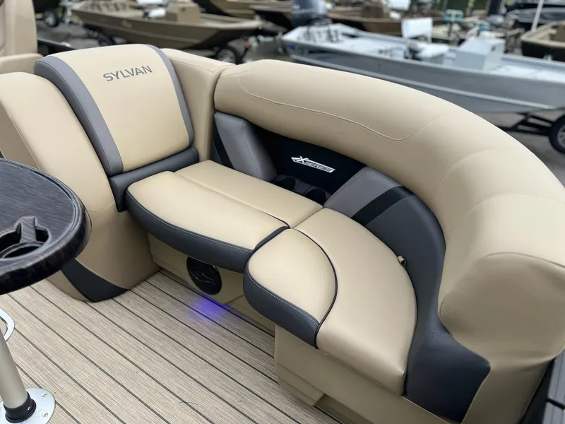 Slide: The Image of 2025 Sylvan X3 CLZ DH Mirage Tritoon, luxurious beige seating, modern design. - 45
