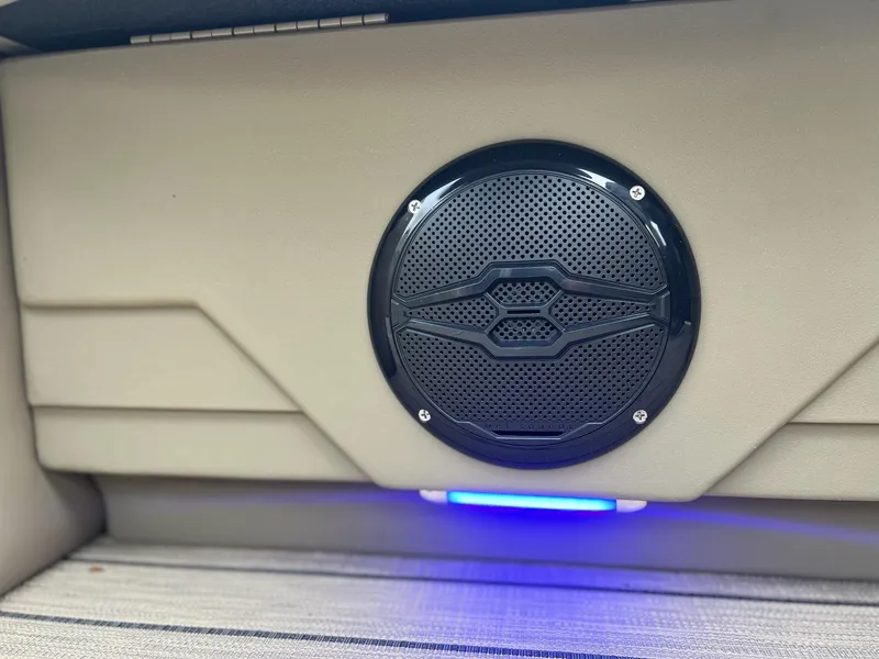 Slide: The Image of Speaker detail in 2025 Sylvan X3 CLZ DH Mirage Tritoon with blue LED lighting. - 7