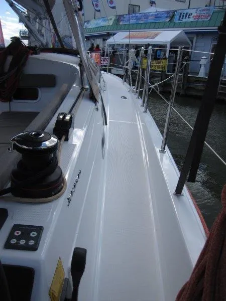 Slide: The Image of 2025 Jeanneau 380 yacht deck with winch and control panel. - 23