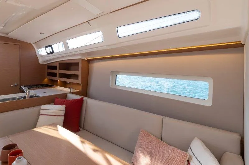 Slide: The Image of Modern interior of 2025 Jeanneau 380 yacht with cozy seating and ocean view. - 48