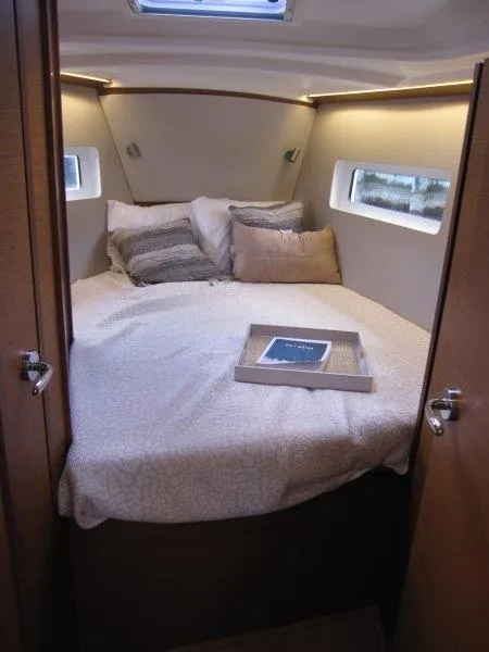 Slide: The Image of Cozy cabin interior of 2025 Jeanneau 380 sailboat with comfortable bedding. - 5
