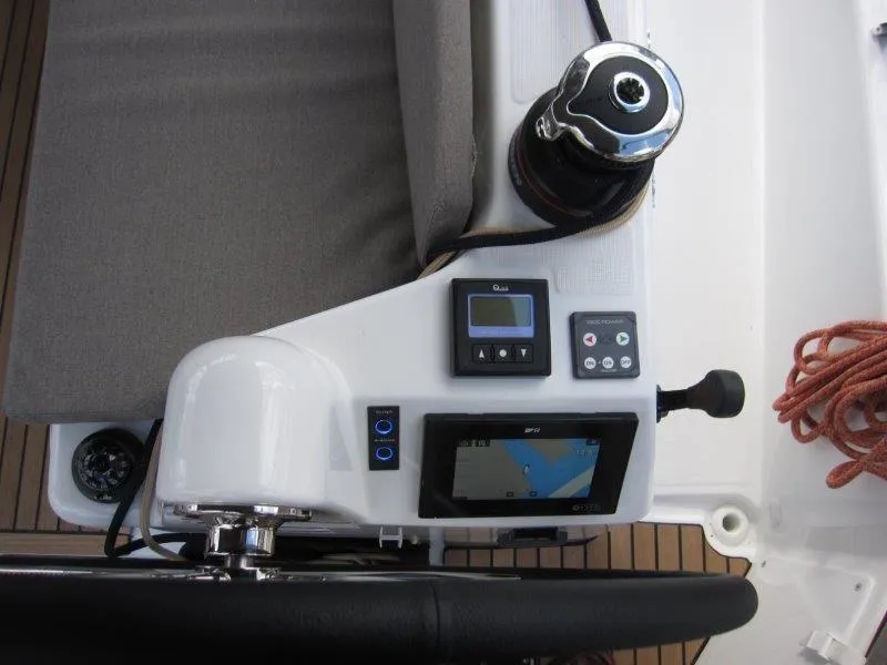 Slide: The Image of Jeanneau 380 2025 yacht helm with navigation controls and winch. - 21