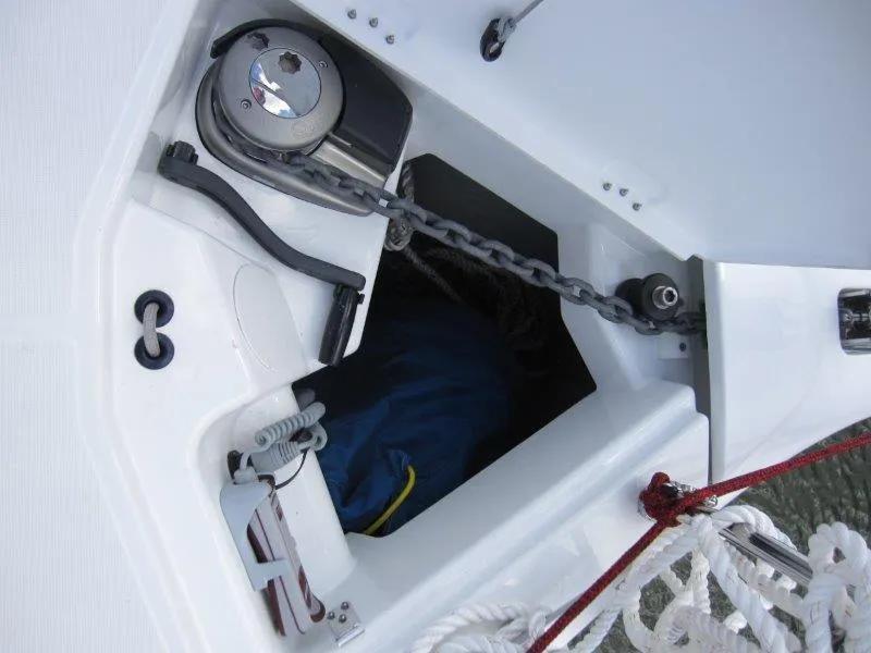 Slide: The Image of Anchor locker of 2025 Jeanneau 380 sailboat with chain and winch. - 25