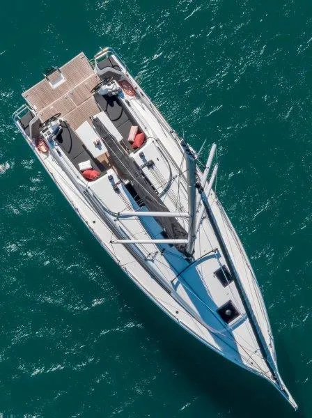Slide: The Image of Aerial view of 2025 Jeanneau 380 sailboat on turquoise water. - 42