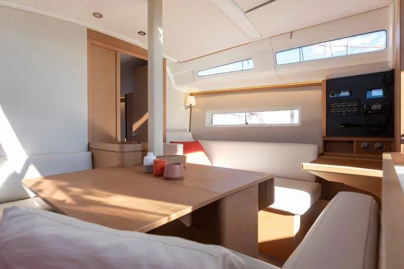 Slide: The Image of Modern interior of 2025 Jeanneau 380 sailboat with light wood and cozy seating. - 44
