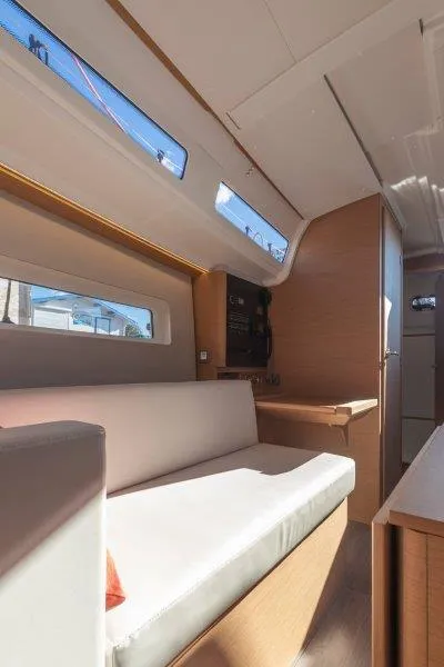Slide: The Image of Interior of 2025 Jeanneau 380 sailboat, featuring modern seating and natural light. - 47