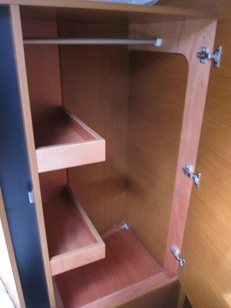 Slide: The Image of Interior storage cabinet of 2025 Jeanneau 380 yacht with shelves and hanging rod. - 5