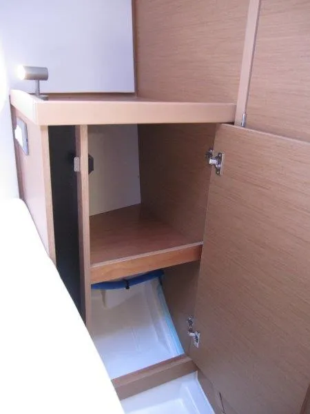 Slide: The Image of 2025 Jeanneau Sun Odyssey 350 interior cabinet with wooden finish. - 28