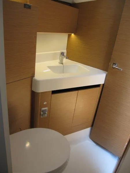 Slide: The Image of Modern bathroom in 2025 Jeanneau Sun Odyssey 350 yacht, featuring sleek design and compact sink. - 23