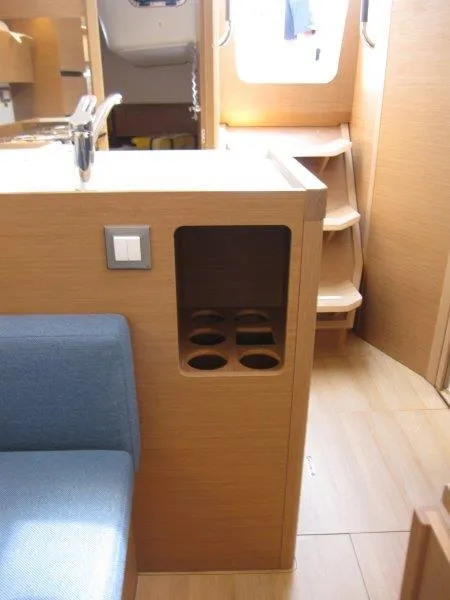 Slide: The Image of Interior of 2025 Jeanneau Sun Odyssey 350 yacht, featuring modern wood finish and seating. - 9