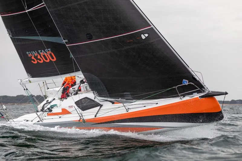 Slide: The Image of 2025 Jeanneau Sun Fast 3300 sailing on open water, featuring sleek design and vibrant colors. - 48