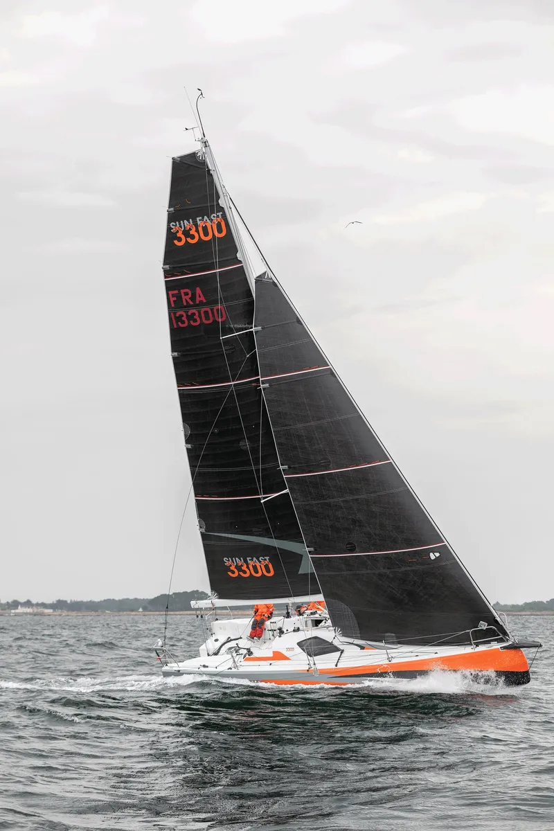 Slide: The Image of 2025 Jeanneau Sun Fast 3300 sailing on open water. - 14