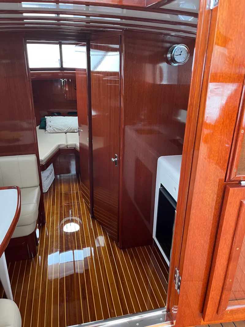 Slide: The Image of Luxurious interior of a 1957 Chris-Craft 33 Futura with polished wood finishes. - 14
